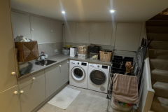 Laundry area with bespoke cabinetry