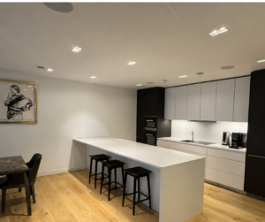 Modern kitchen refurbishment in Notting Hill London featuring a large island, bespoke cabinetry and oak flooring