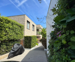 Exterior view of a residential refurbishment project in Notting Hill London with landscaped surroundings and modern architecture