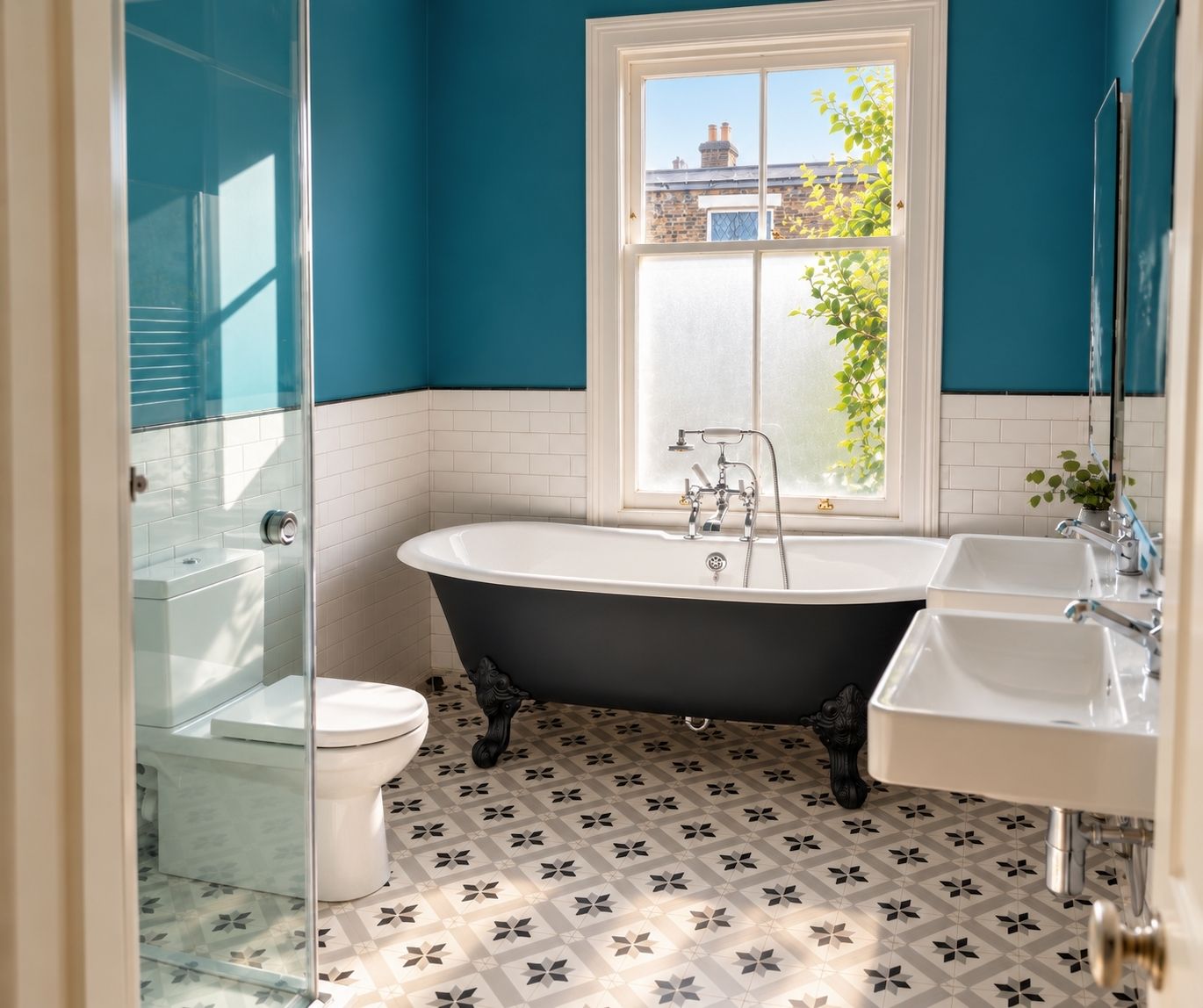 Renovated bathroom in South-West London with a black freestanding bath, walk-in shower and patterned tiled floor.