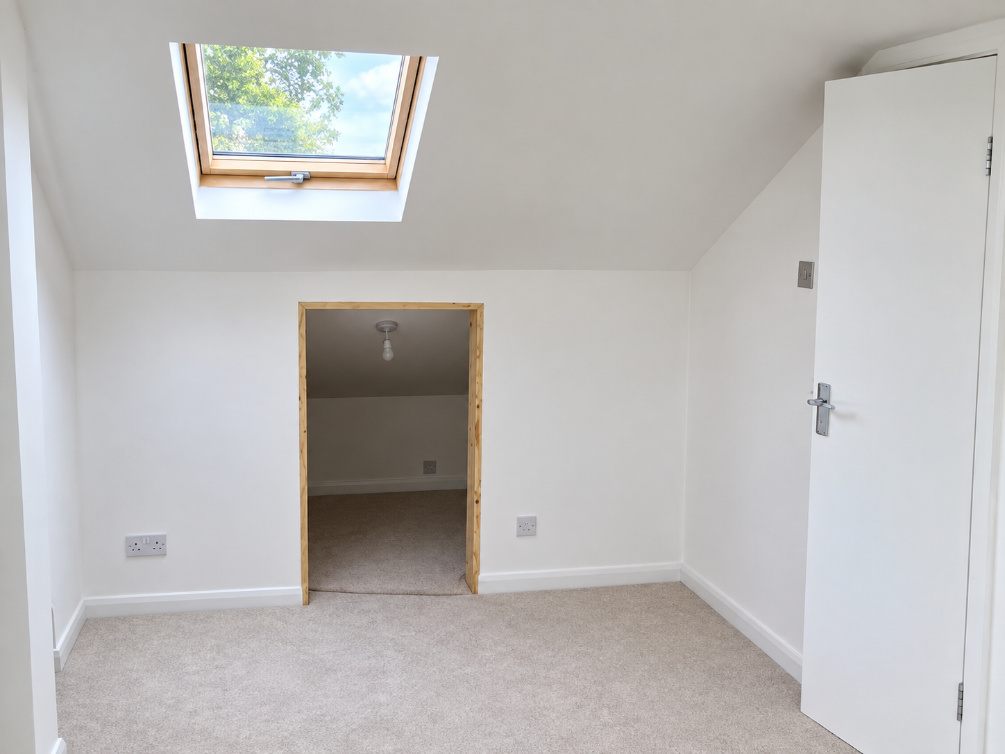 Completed loft conversion interior with roof window and additional living space