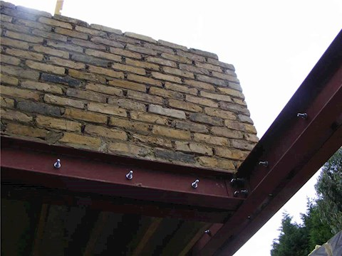 Structural steel beam installed during a house extension project
